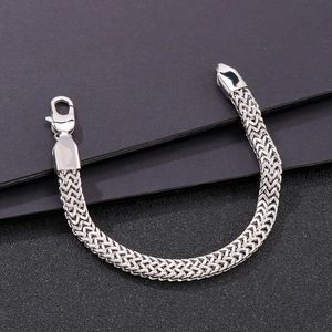 Detailed close-up of a silver stainless steel flat snake chain with a lobster clasp