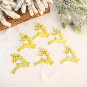 Set of 6 golden Christmas reindeer ornaments on snow background for tree decoration