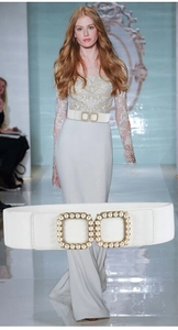 Close-up of white elastic waist belt with luxury square buckle inlaid with white pearls
