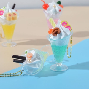 Miniature faux sundae dessert keychain with cream and fruit detail in macaron colors