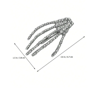 Détail de la pince à cheveux main de squelette argentée avec strass et dimensions