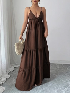 Elegant brown tiered V-neck maxi dress with spaghetti straps and ruffle details