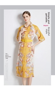 Detail of floral midi shirt dress with yellow waist belt and orange purple blossoms