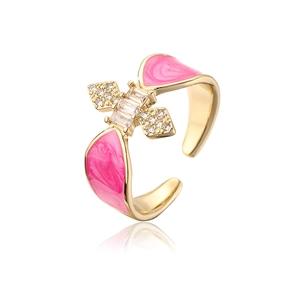 Detail of 18K gold-plated butterfly ring with pink enamel and micro-set zircons
