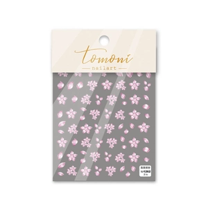 Detail of pink cherry blossom nail stickers with cute floral patterns in clear packaging