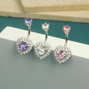 Detailed macro view of heart-shaped crystal belly rings in purple, clear, and pink sets