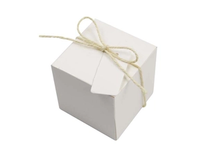 Close-up of white square gift box with natural twine and blank hanging tag