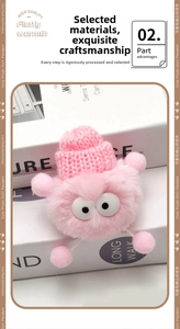 Detail of pink plush doll charm with knit hat and large eyes for DIY footwear accessory