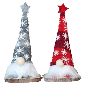 Christmas faceless gnomes with knitted hats and wooden bases for holiday decor