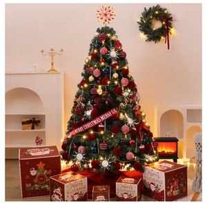 Detailed set of a lit Christmas tree with red gift boxes and festive ornaments