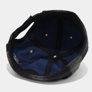 Distressed grey denim docker cap featuring adjustable strap and inner lining detail