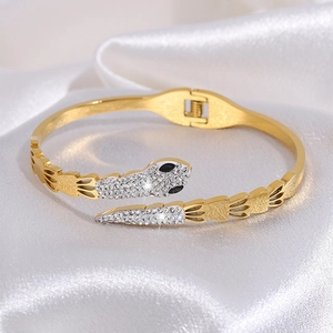 Golden titanium steel snake-shaped hinged bracelet with sparkling rhinestones on silk