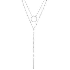 Close-up of golden double-layer stainless steel necklace with geometric circular and bar pendants