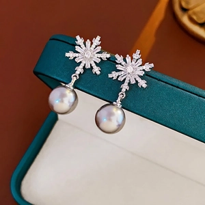 Silver needle snowflake pearl earrings with zircon inlay for elegant winter fashion styling