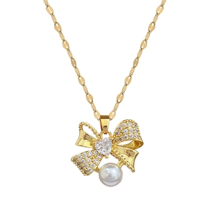 Golden titanium bow necklace with heart-shaped zircon and pearl pendant on fishbone chain