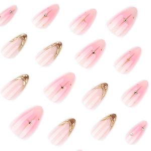 French press-on nails with pink gradient, golden stars, and 3D rhinestone accents