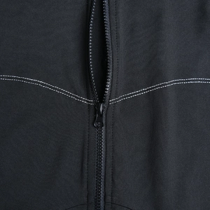Close-up of black ribbed fabric bodysuit featuring resin zipper and white double stitching