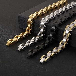 Mens stainless steel link bracelets in gold, silver, and black on a textured gift box