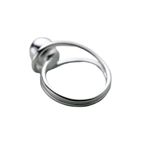 Minimalist silver spherical ring featuring a polished metal ball and sleek circular band