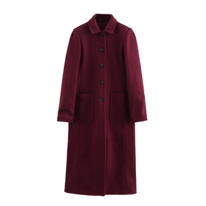 Close-up of wine red wool blend coat featuring single-breasted buttons and front pockets