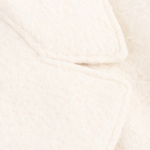 Detail shot of the white plush fabric texture and collar stitching on long wool coat