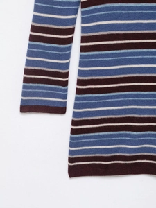 Detail view of multicolored striped knit fabric texture with navy and burgundy stripes