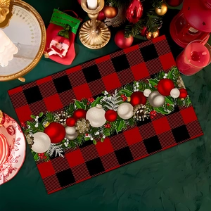 Close-up of red and black buffalo plaid Christmas placemat with festive pinecone ornaments
