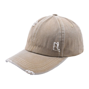 Close-up of distressed khaki baseball cap featuring vintage washed fabric and side embroidery