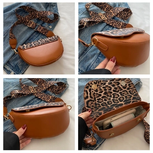 Brown saddle bag with leopard print strap showing side profile and spacious interior