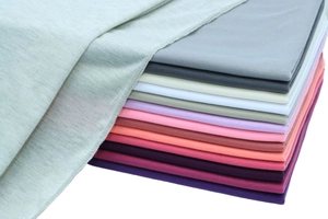 Detail of multi-color jersey knit fabric swatches showing soft texture and premium edges