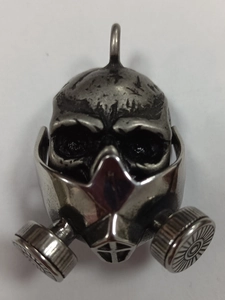 Close-up of retro gas mask skull pendant with detailed stainless steel vintage finish
