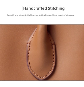 Close-up of handmade stitching and premium leather texture on a vintage brown tote bag
