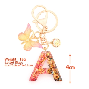 Resin Alphabet A Keychain with colorful gold foil glitter and butterfly pendant