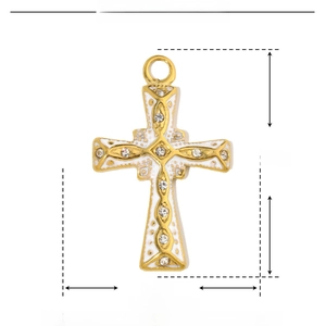 Detail view of gold stainless steel cross pendant with white enamel and rhinestones