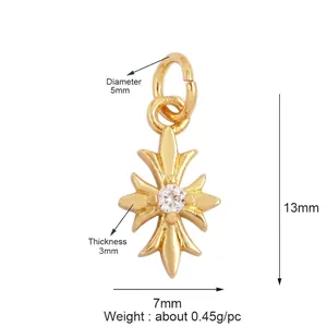 Detail of a gold-plated cross pendant with dimensions 13mm by 7mm and inset zircon stone