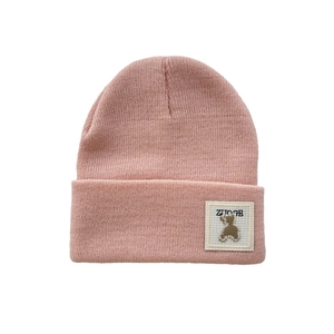 Pink double-layer knit beanie for kids featuring a cute brown bear label patch