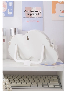 Rear view of white cloud makeup mirror showing foldable stand and wall hanging hole