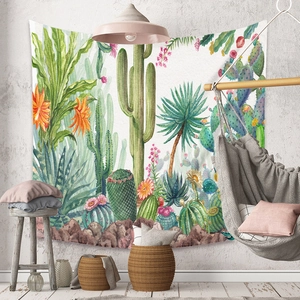 Detail of bohemian tapestry featuring hand-drawn tropical cacti and desert plant patterns