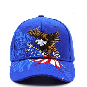 Detail of royal blue baseball cap with eagle and American flag embroidery patterns