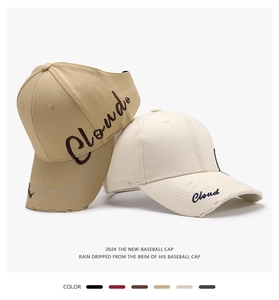 Detail of embroidered letters on ponytail sun visors with various color swatches