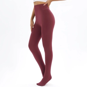 Detailed view of high-waist thermal leggings in burgundy with wide ribbed waistband