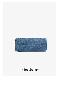 Detailed bottom view of the hand-woven blue denim tote bag showing tight weave patterns