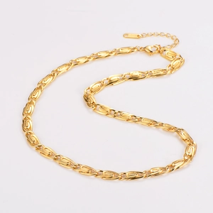 Detailed macro view of gold-plated paperclip chain necklace with 18KGP hallmark engraving