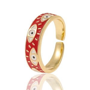 Adjustable golden evil eye ring with red enamel finish and polished metal surface