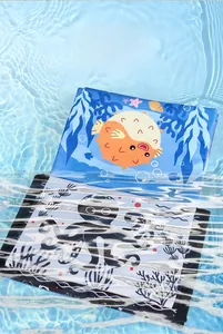 Waterproof baby cloth book with ocean theme showing octopus and pufferfish illustrations
