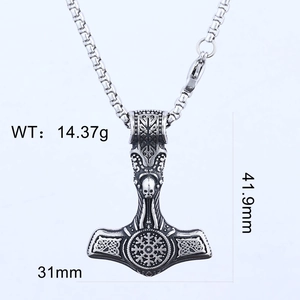 Close-up of Viking Mjolnir pendant showing dimensions 31x41.9mm and engraved silver detail