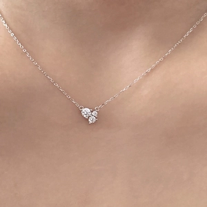 Elegant 925 sterling silver necklace with a delicate zircon cluster pendant on a model