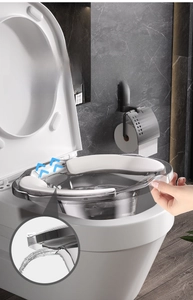 Close-up of transparent sitz bath with white cushion pad and anti-overflow drainage holes
