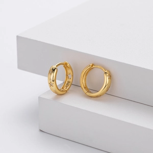Detailed macro view of gold plated S925 silver star hoop earrings with zircon stones