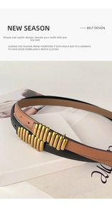 Close-up of genuine leather belts with unique gold metal buckles on fashion magazines